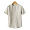 Front view of a beige men's short sleeve linen shirt on a wooden hanger