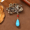 Blue Phoenix Brooch with Faux Turquoise Drop
