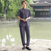 Model wearing a dark blue cotton linen meditation set by a pond