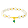 White jade bead bracelet with gold-tone bamboo charm and green leaf pendant on wrist