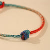 Hand-woven Red and Blue Knot Bracelet