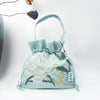 Embroidered Drawstring Bucket Bag with Tassel, Floral and Animal Motifs