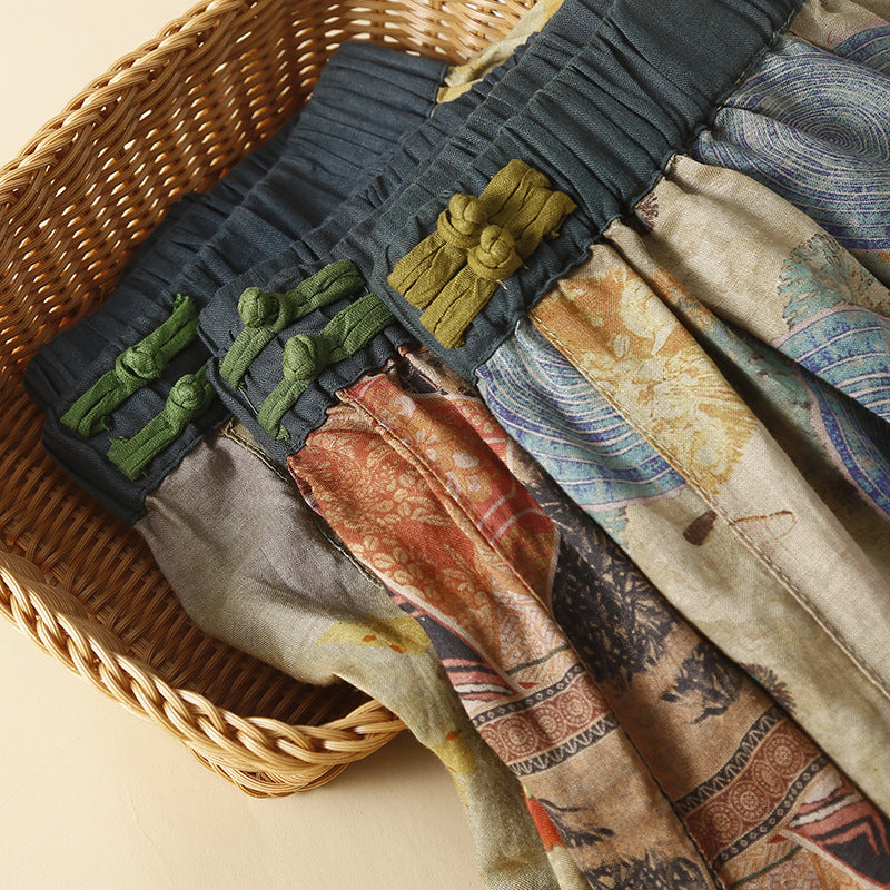 Close up of the elastic waistband showing green and yellow frog buttons on patterned fabric