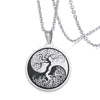 Round stainless steel pendant with laser engraved tree of life and yin yang design on a chain