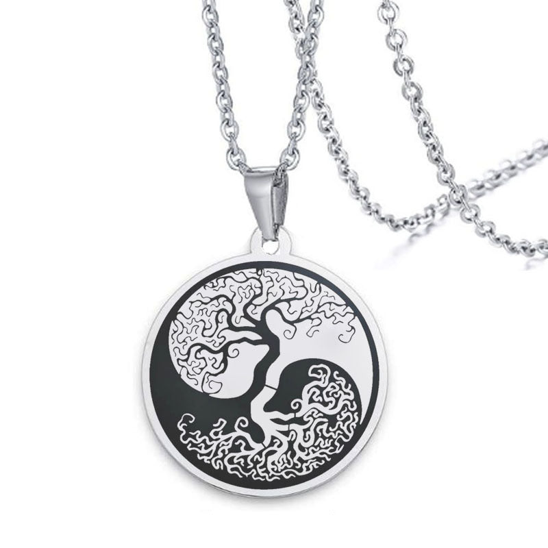 Round stainless steel pendant with laser engraved tree of life and yin yang design on a chain