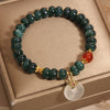 Blue jade abacus bead bracelet with a white jade peace buckle charm and gold accents