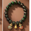 Swallowing Beast Liuli Glass Bead Bracelet with Gold Tone Charms