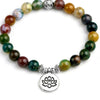 Colorful agate bead bracelet with a silver tone lotus charm on a white background