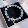 Cat's Eye Glass Bracelet with Star and Moon Charms