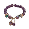 Purple amethyst bead bracelet with gold tone teardrop charm