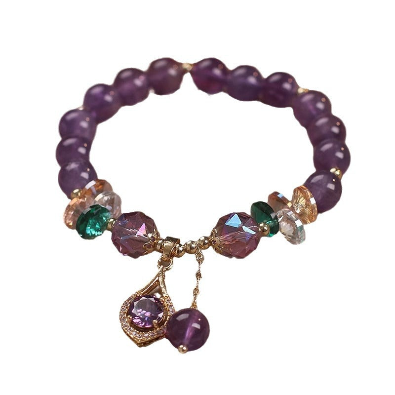 Purple amethyst bead bracelet with gold tone teardrop charm