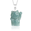 A light green jade lucky cat pendant hanging from a silver chain on a white background