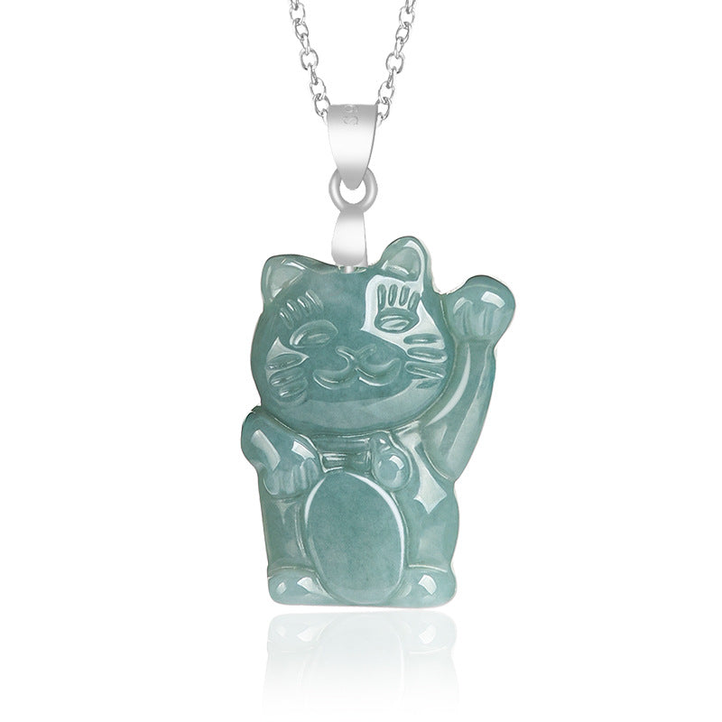 A light green jade lucky cat pendant hanging from a silver chain on a white background