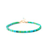 Gold-tone clasp detail on a turquoise beaded bracelet