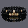 Gold-tone crown charm bracelet with black 8mm beads wrapped twice