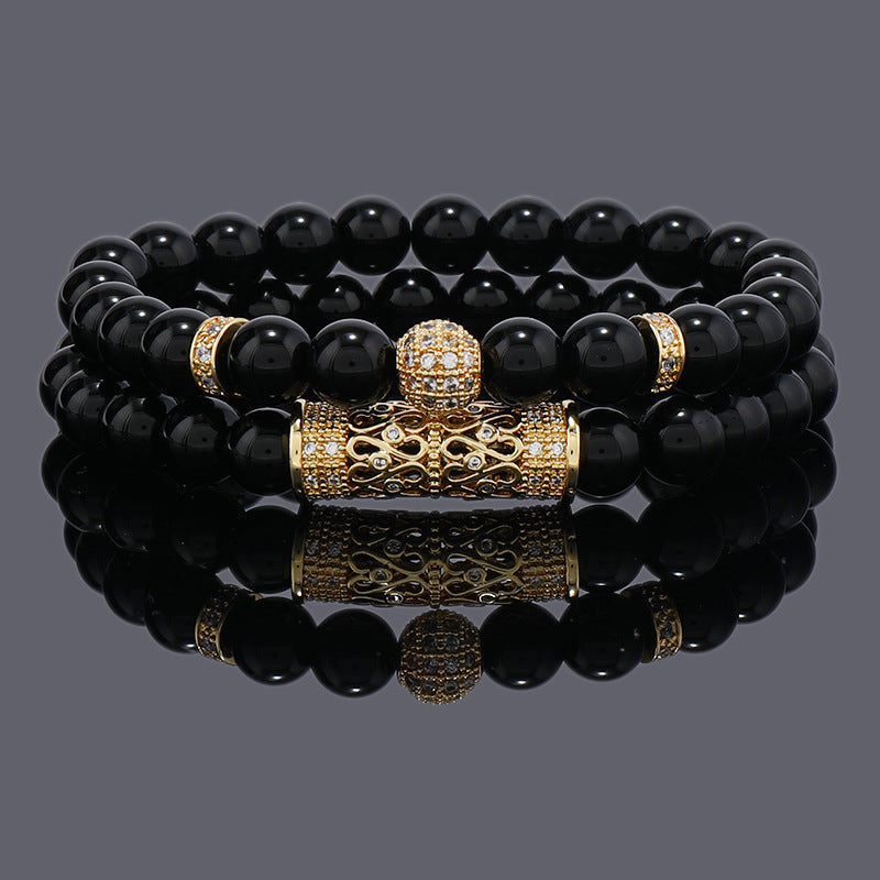 Gold-tone crown charm bracelet with black 8mm beads wrapped twice
