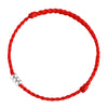 Close up view of a red braided cord bracelet with three silver beads