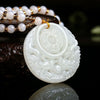 White double dragon Bagua pendant on a beaded string