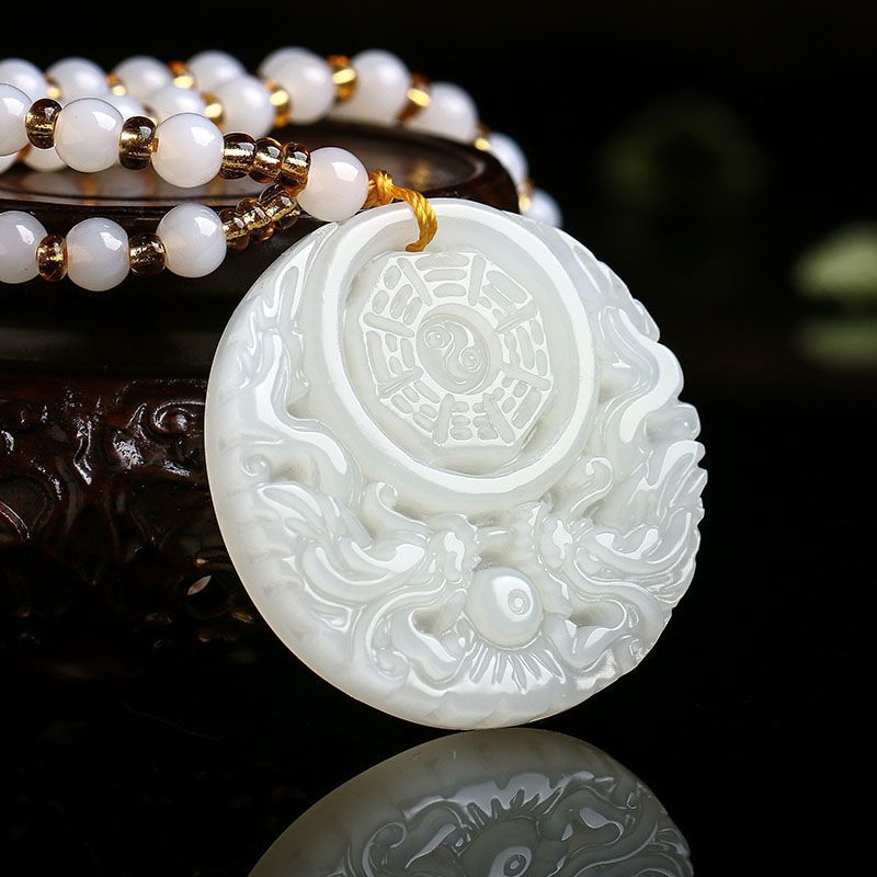 White double dragon Bagua pendant on a beaded string