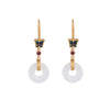 Gold-tone earrings with a blue butterfly and a white faux jade ring hanging from a display stand.