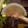 Mini Hollow Carved Bamboo Folding Fan with Tassel