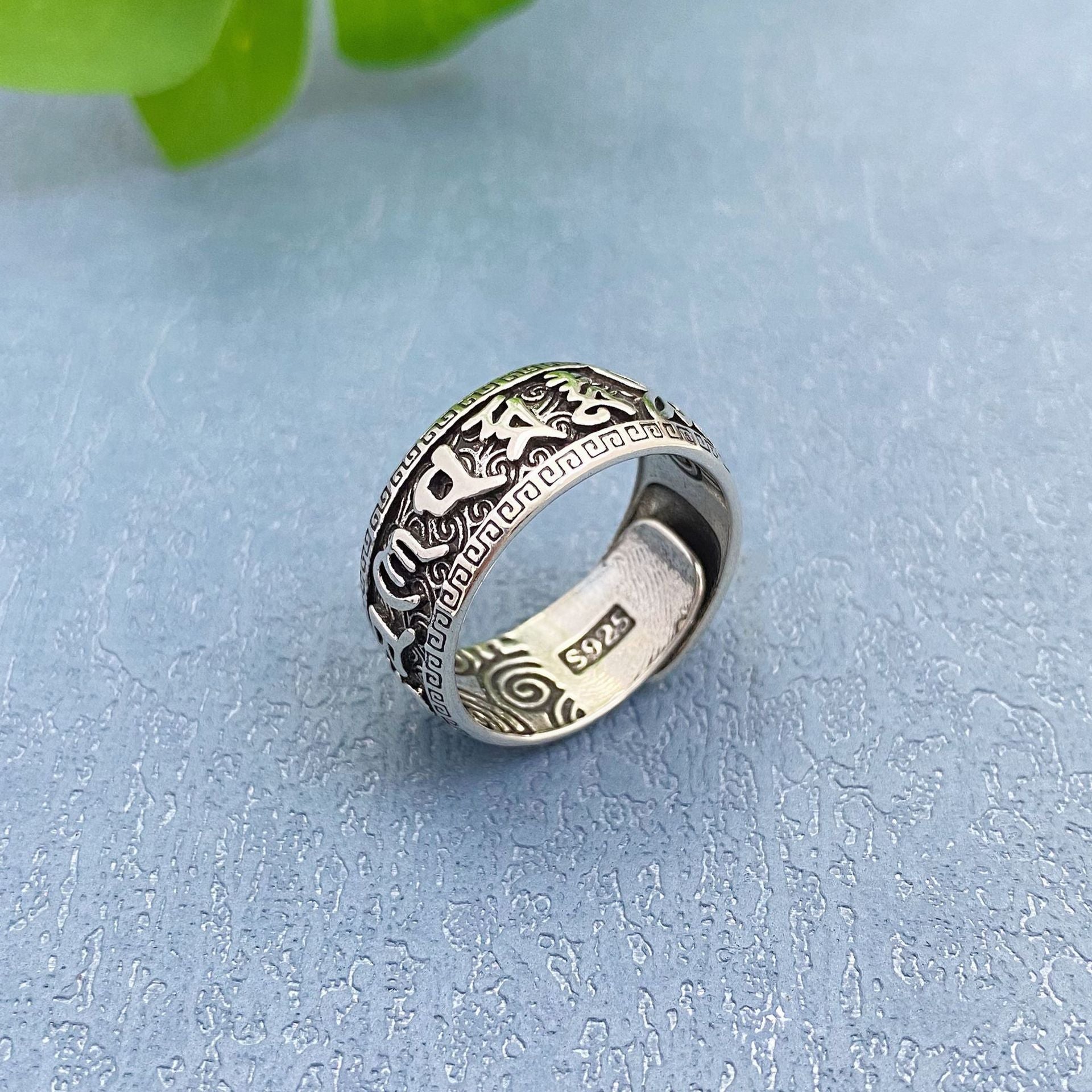 Silver tone copper ring with Om Mani Padme Hum engraving