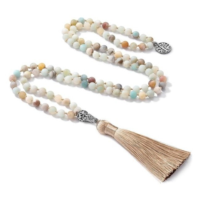 Natural stone beaded necklace with Tree of Life pendant and beige tassel on white background