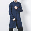 Man wearing a navy blue mid-length linen coat with traditional frog buttons