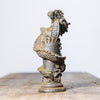 Resin statue of a dragon coiled around a pillar with a textured finish