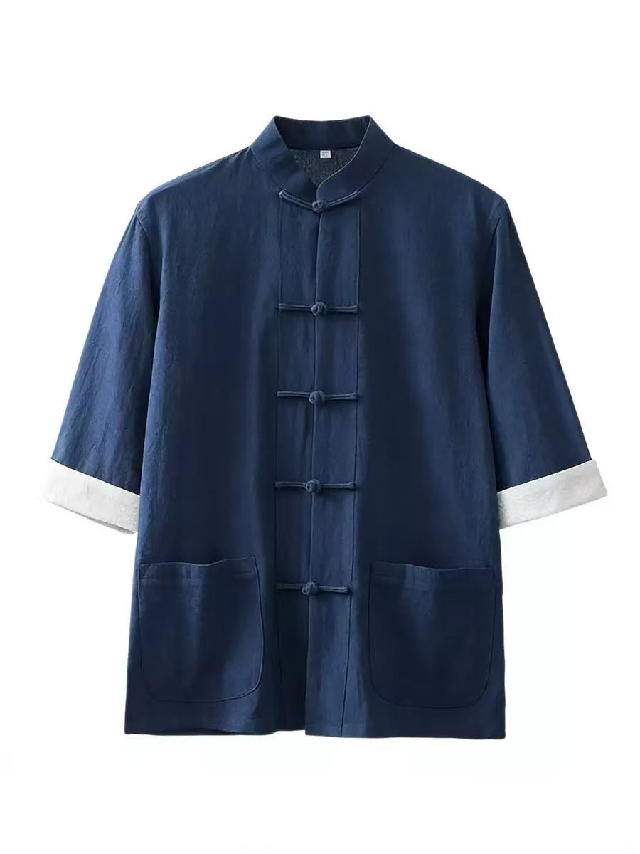 Front view of a navy blue men's Tang suit shirt with white cuffs