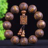 Close-up of a carved wooden bracelet with zodiac animal engravings on round beads