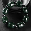 Polished green jade Lulutong barrel bead bracelet with black spacers