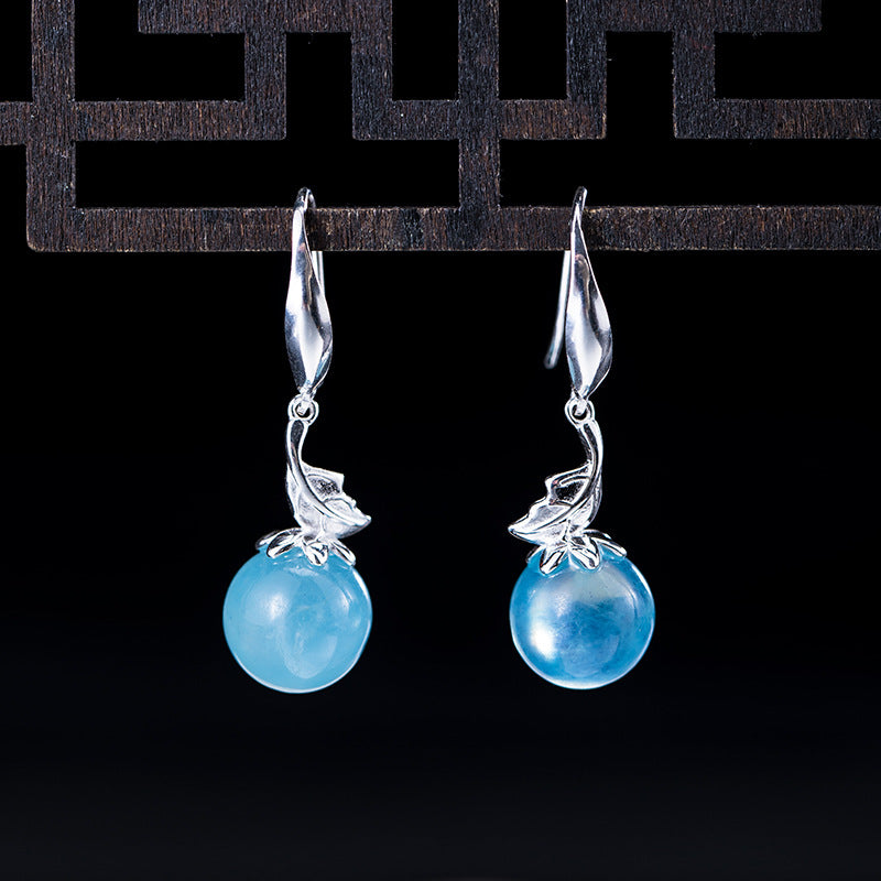 Pair of 925 sterling silver drop earrings with round blue aquamarine stones and leaf details