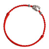 Close up of a red braided rope bracelet with a silver tone copper rabbit charm