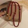 Cinnabar Triple Wrap Bracelet with Gourd and Flower Charms