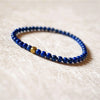 Blue Lapis Lazuli Bead Bracelet with Gold Tone Accent
