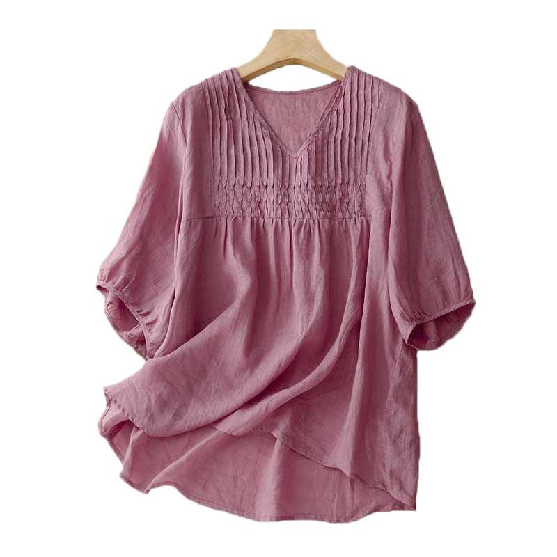Pink cotton linen women's shirt with V-neck and half sleeves on a hanger