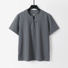 Front view of a grey men's linen t-shirt with a v-neck and frog button closure on a hanger