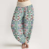 Model wearing green floral print women's harem pants