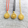 Three gold-tone copper pendants with Fu characters on red, black, and gold cords