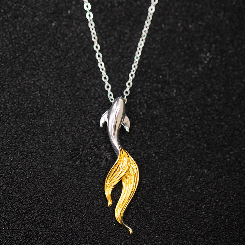 Sterling silver koi fish necklace with a gold-tone tail on a silver chain