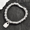 Silver-Plated Beaded Bracelet with Geometric Charms