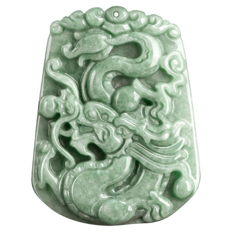 Carved bean green jade dragon pendant hanging from a beaded cord