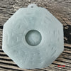 Small pale green jade pendant with octagonal Bagua shape and central Yin Yang carving