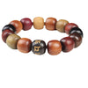 Close up of a dark wood bead with gold engraving on a multi-colored wooden bracelet