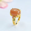 Adjustable Orange Moonstone Ring with Vine Detail