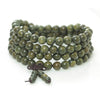 Coiled green sandalwood mala bracelet with 108 round beads and a knotted tassel