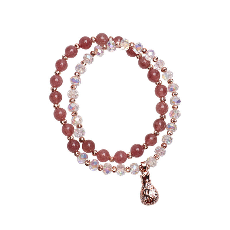 Double wrap bracelet with pink strawberry quartz and white crystal beads featuring a gold-tone money bag charm