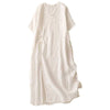 White cotton linen midi dress with V-neck and frog buttons laid flat