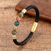 Close up of a black braided leather bracelet with colorful stone beads
